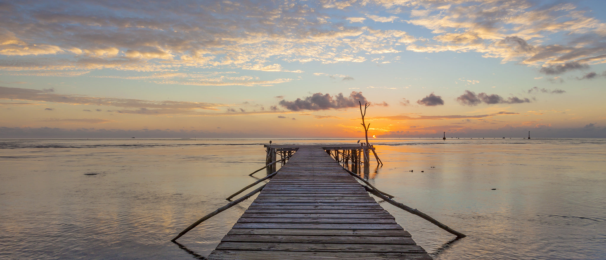 Sitting on the Dock of the Pass